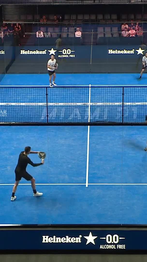 Capra wins the rally with a forehand volley, and the ball hits Rubio in the face