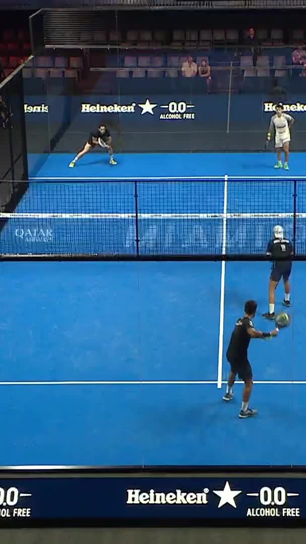 Sanz hits a powerful smash down the middle